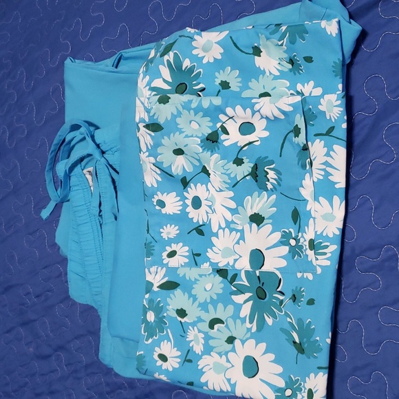 One set printed scrub top with matching pants. Scrub set fits generously. - Picture 1 of 4